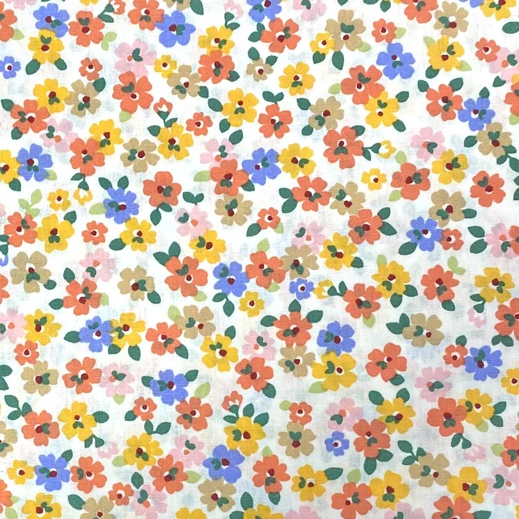 Cotton Poplin Fabric with Small Orange and Purple Flowers on Light Cream