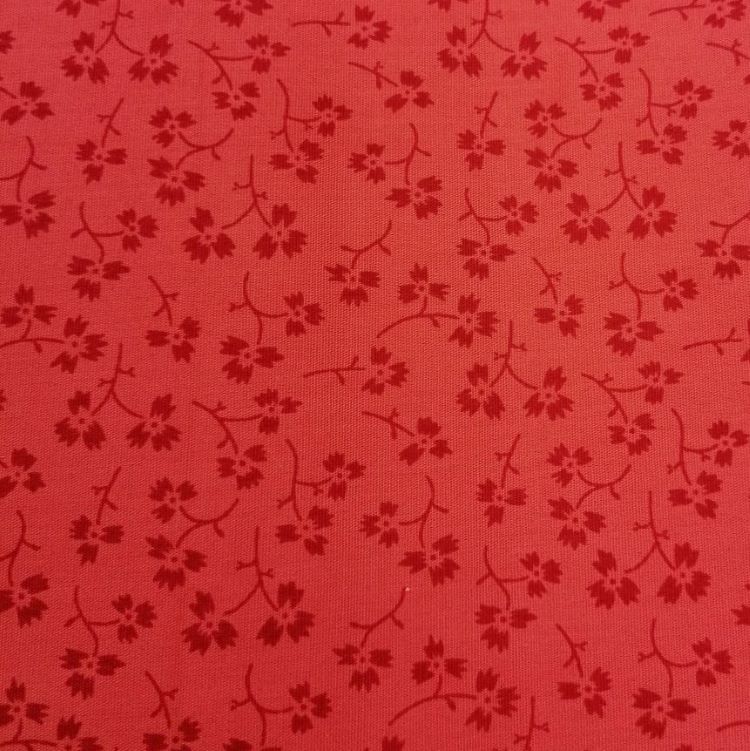 Quilting Fabric with Flowers on Coral from Ombre Trends by Heather Jacks for The Craft Cotton Company