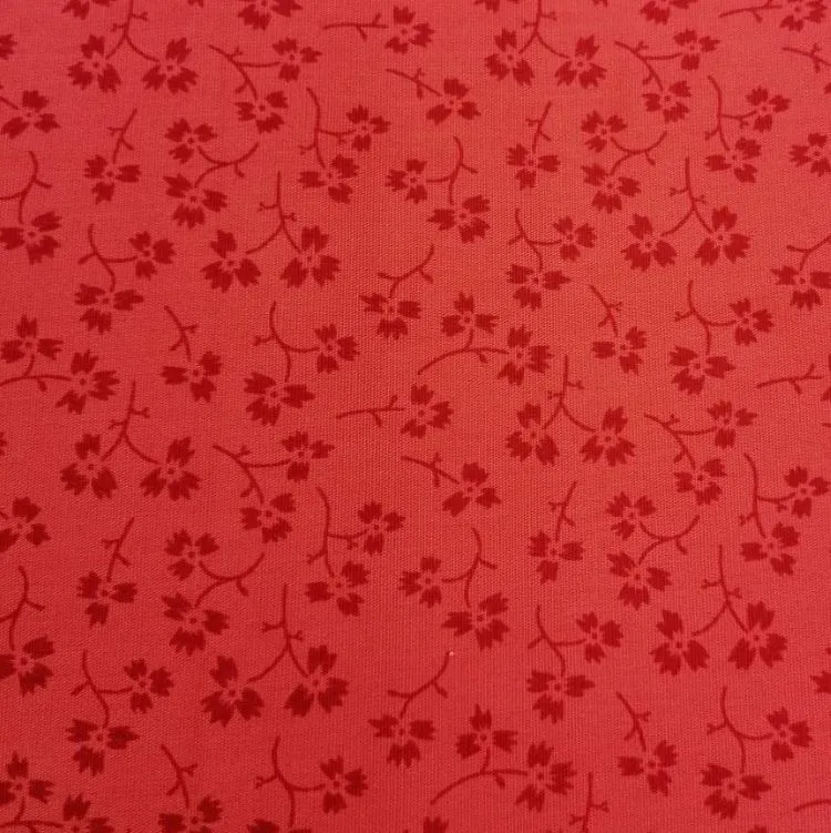 Quilting Fabric with Flowers on Coral from Ombre Trends by Heather Jacks for The Craft Cotton Company